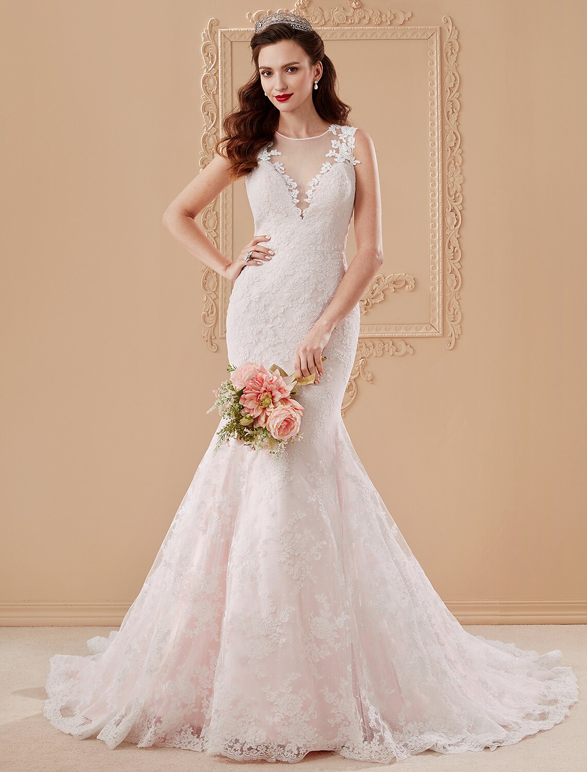 Mermaid Trumpet wedding dress with plunging neckline and lace appliques.