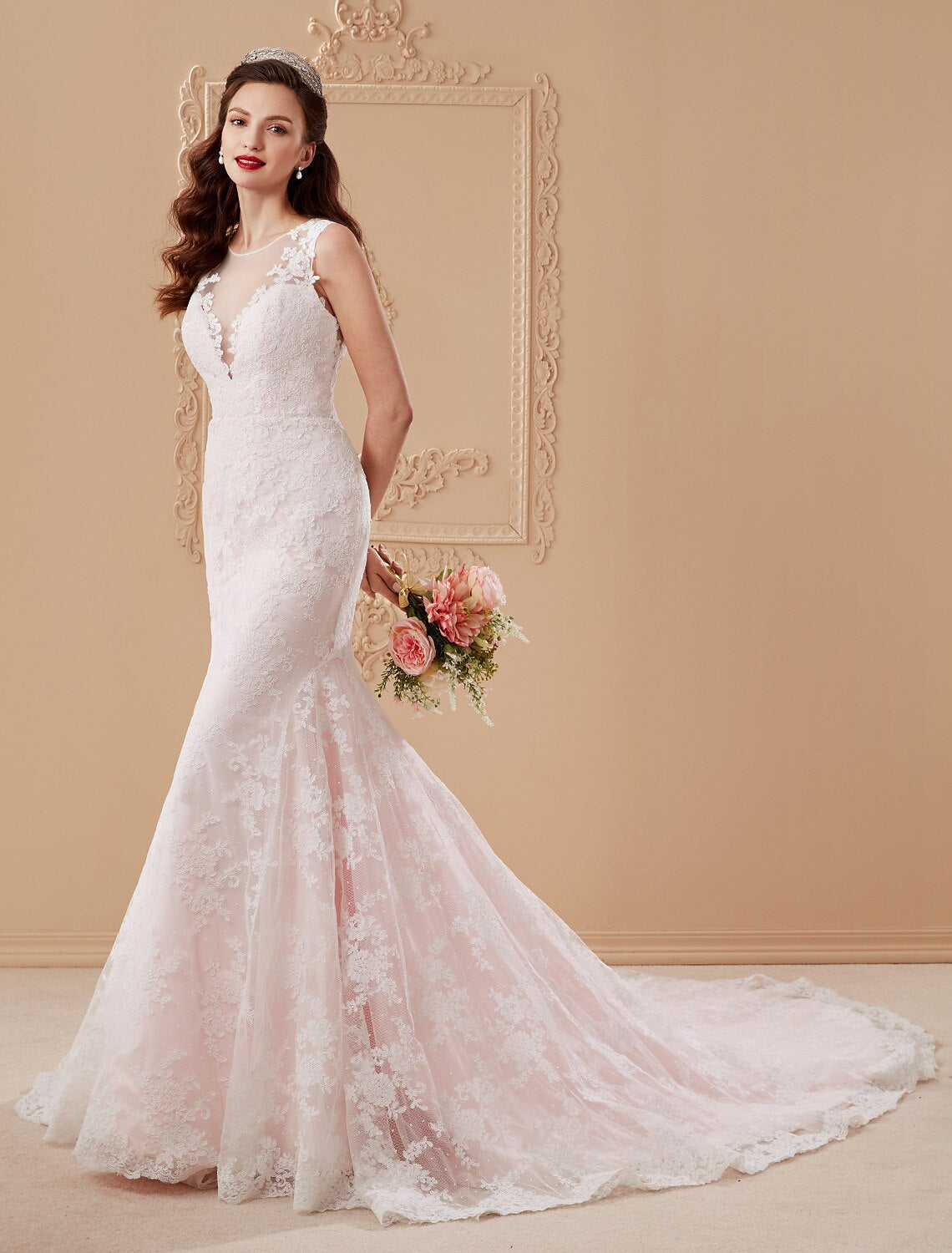 Bride posing in a Mermaid Trumpet lace wedding dress.