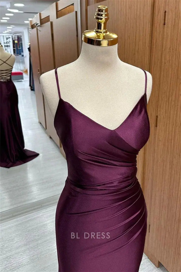 Full view of the long mermaid V-neck evening gown, showcasing its pleated details.