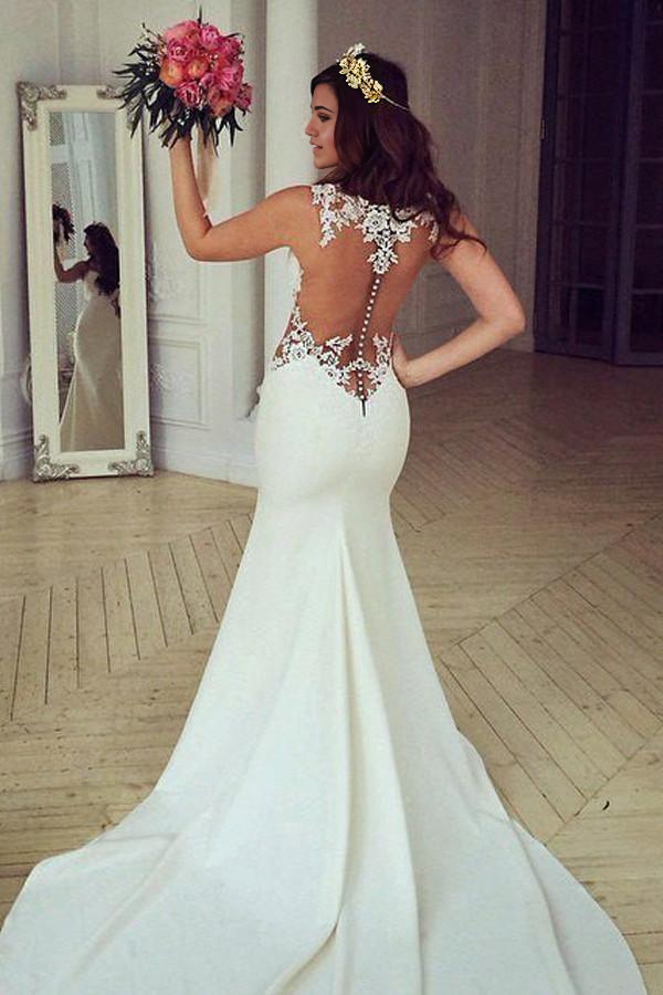 Side view of the stunning mermaid V-neck lace bridal gown.