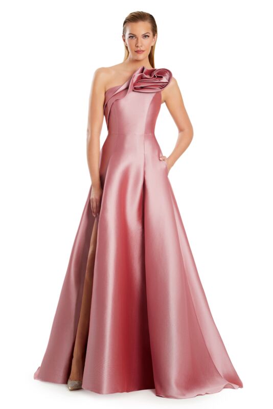 Front view of a woman in a purple one-shoulder pleated A-line prom dress.