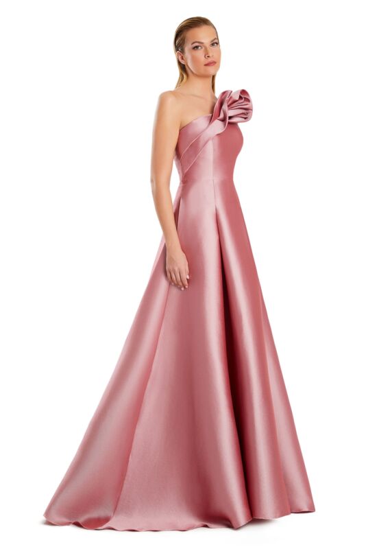 Back view of a woman in a purple one-shoulder pleated A-line prom dress.
