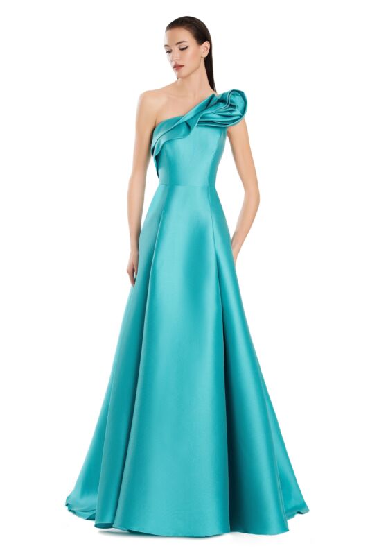 Full length view of a woman in a purple one-shoulder pleated A-line prom dress.