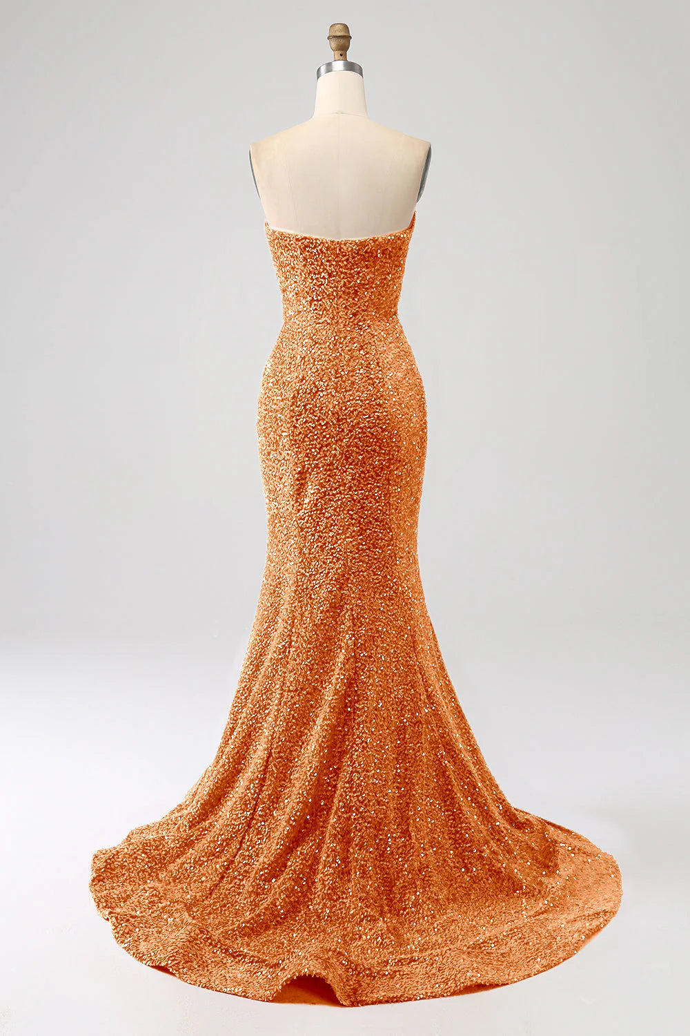 Orange mermaid prom dress with sweetheart neckline and sweep train, back view.