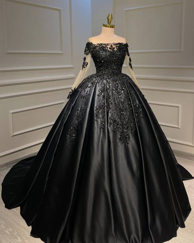 Plus size woman in an elegant A-line long sleeve satin prom dress with lace appliques.