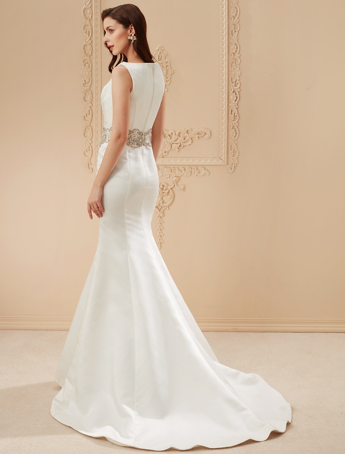 Back view of the mermaid wedding dress, showcasing the dramatic chapel train.