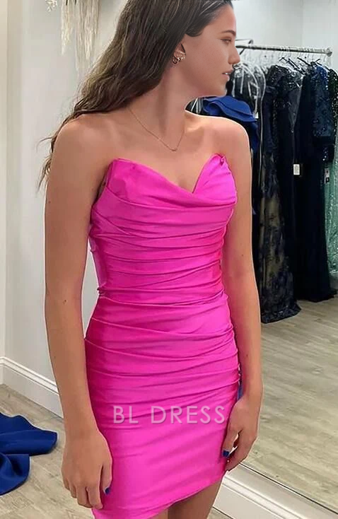 Model wearing a pink strapless short sheath homecoming dress.