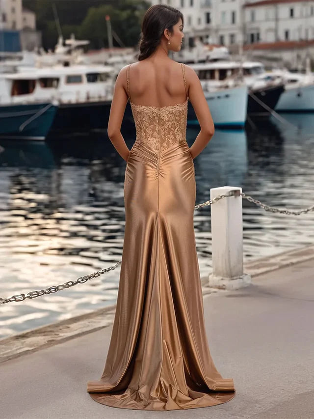 Side view of the mermaid prom dress, highlighting the leg split and lace details.