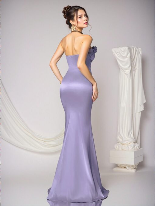 Detailed view of the delicate handmade floral design on the lavender strapless dress.