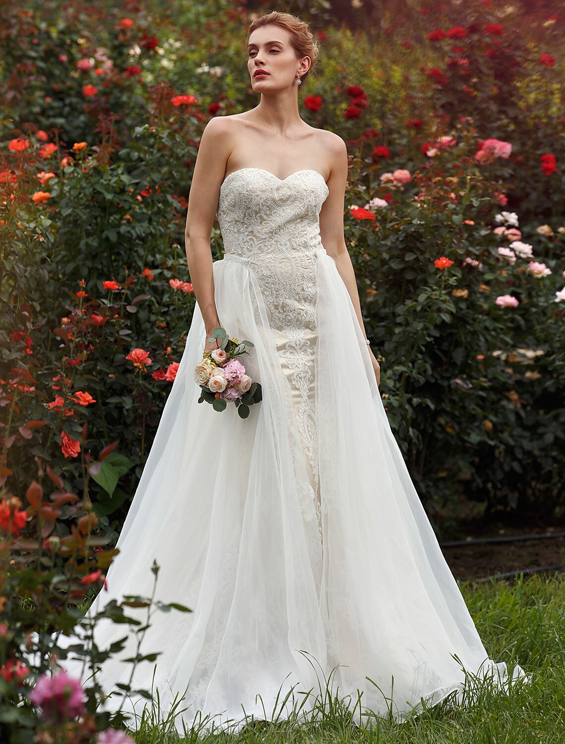 Back view of the strapless mermaid wedding dress, showcasing the elegant court train and lace details.