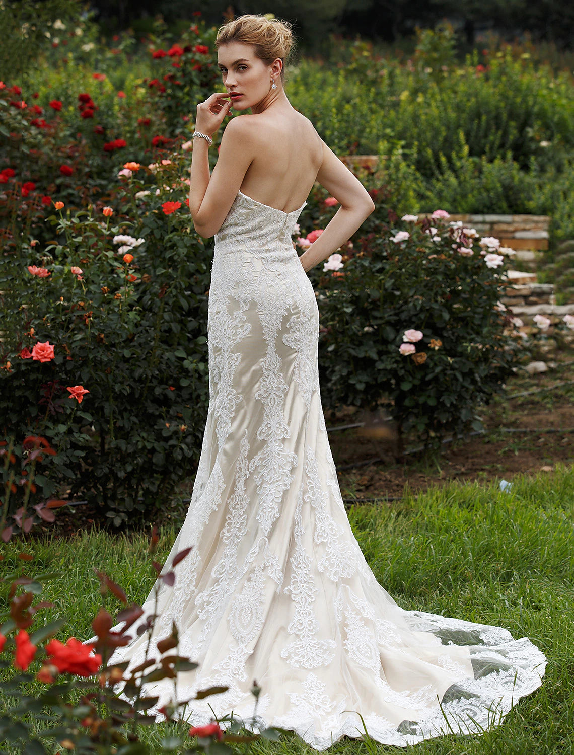 Full length view of the mermaid wedding dress, emphasizing its flattering shape and design.