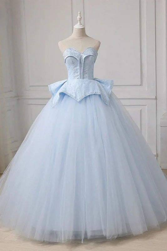 Elegant sweetheart tulle ball gown with intricate beading and a sweep train.