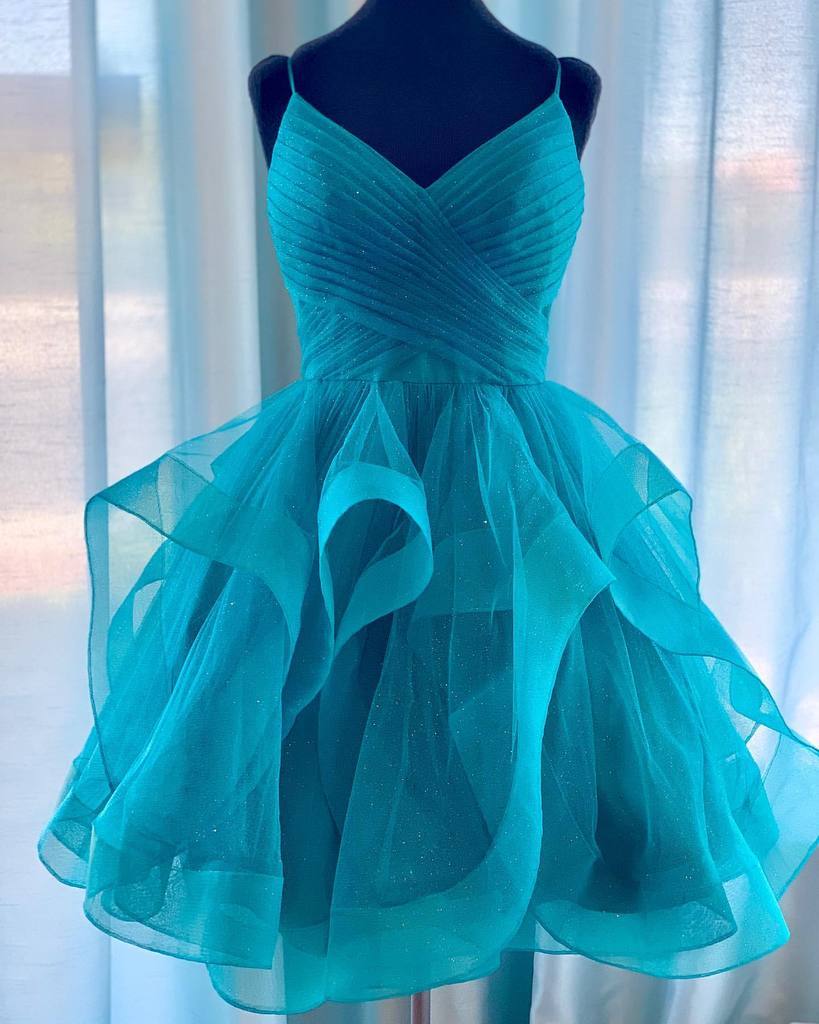 Woman wearing an A-line V-neck short formal dress.