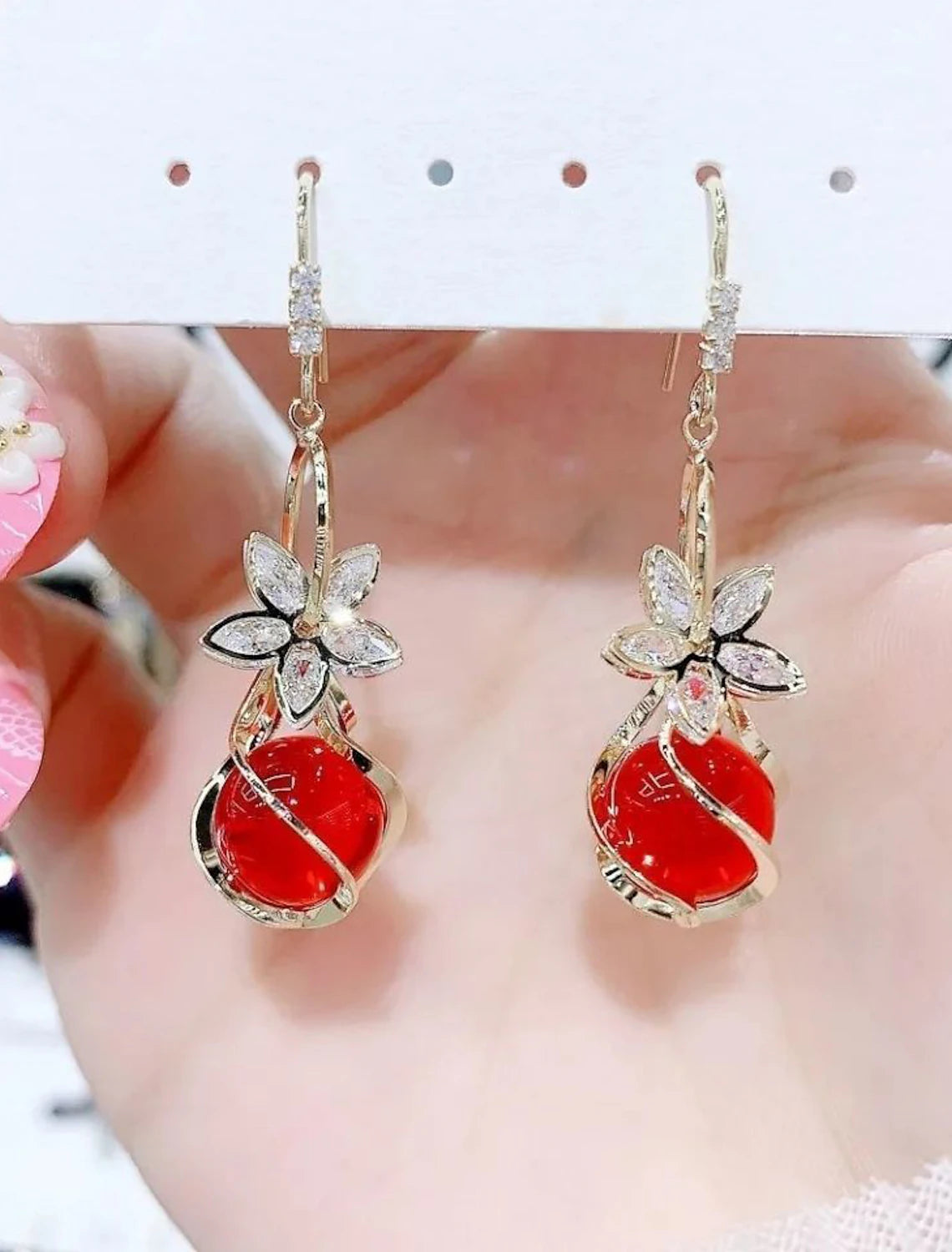 Detailed view of a petal opal drop earring.