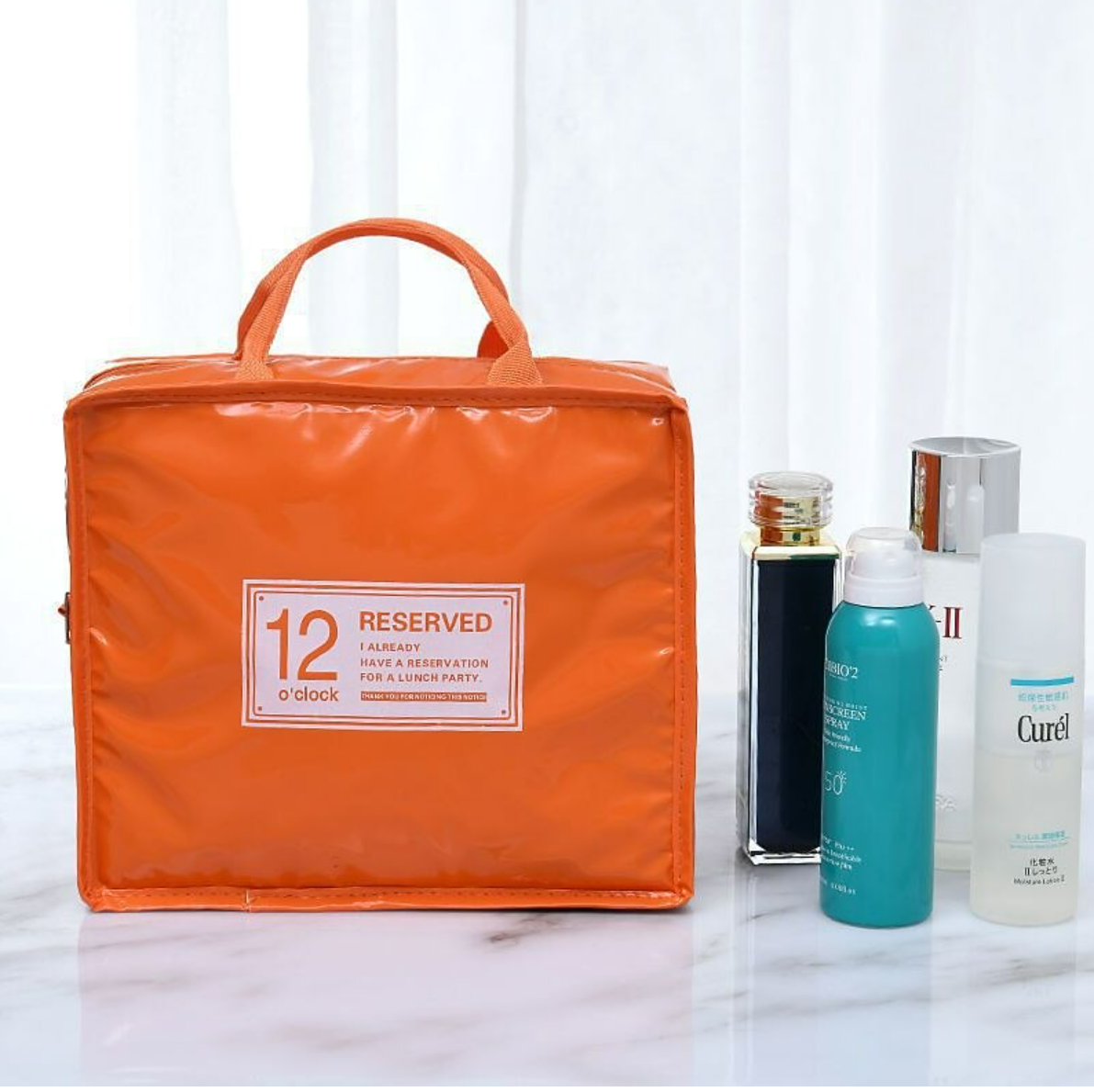 Open portable cosmetic bag showing multiple compartments.