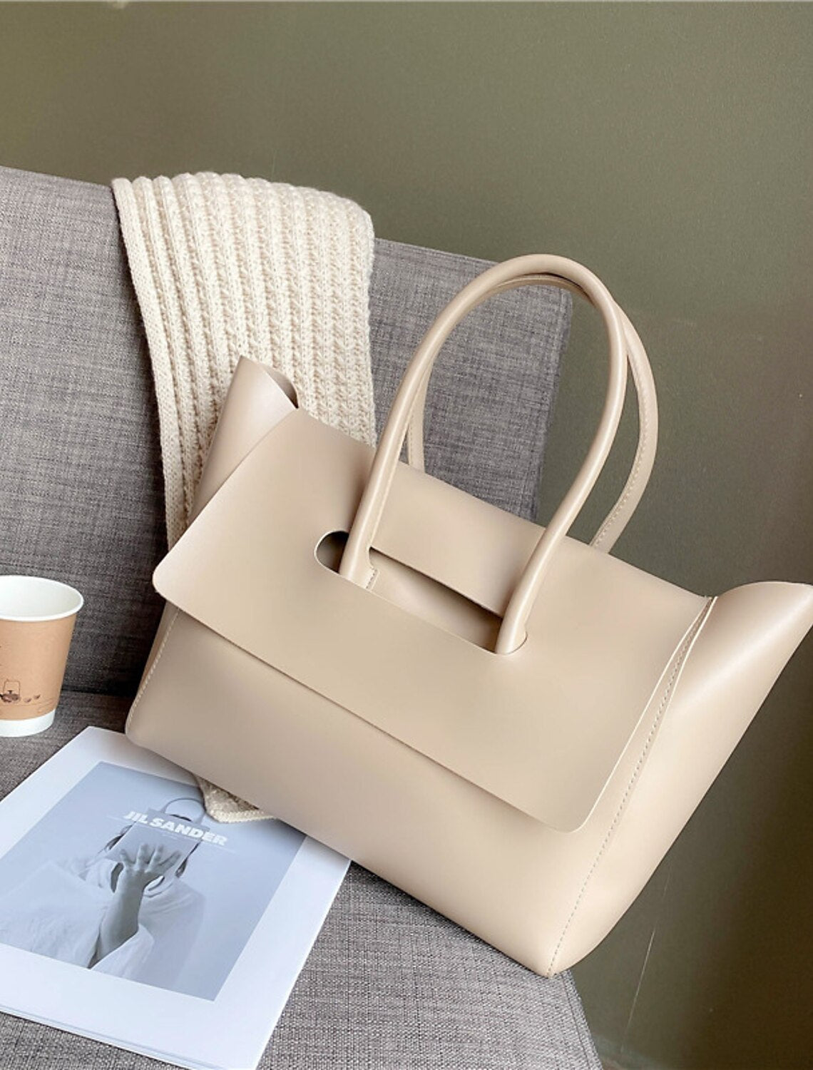 Coffee brown hobo bag with interior view showing spacious storage.