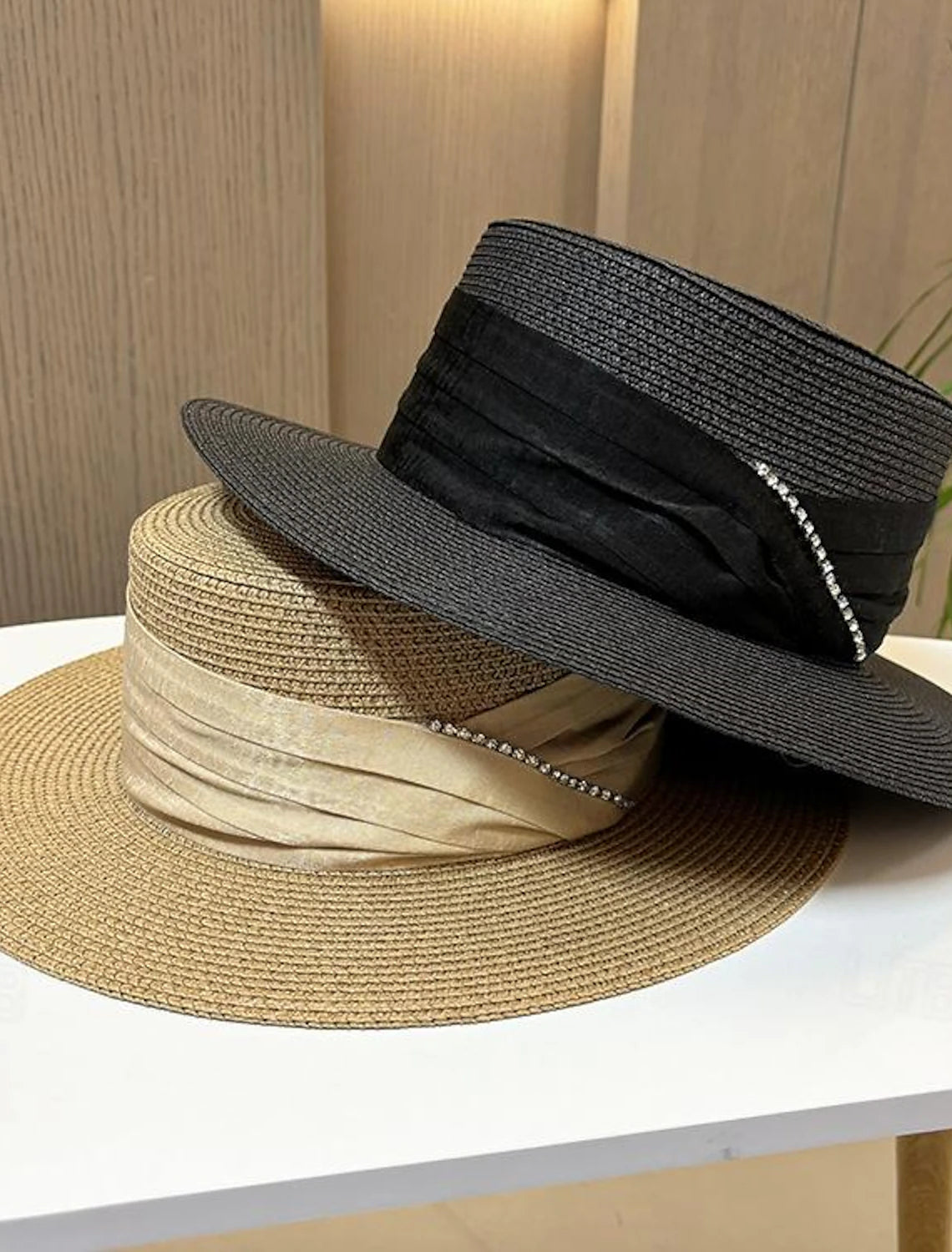 Front view of the elegant fascinator hat on a model.