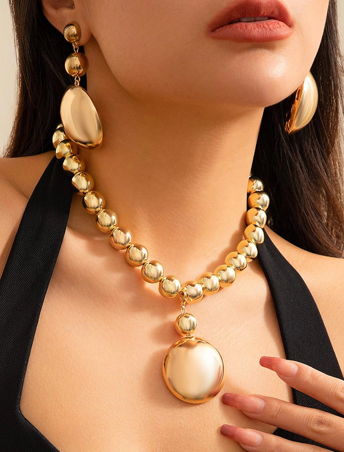 Woman posing, showcasing the vintage acrylic donut jewelry set.