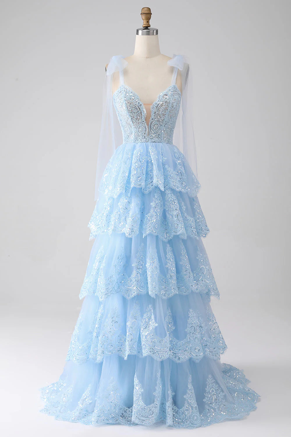 Sweetheart straps tiered tulle prom dress with sequin appliques.