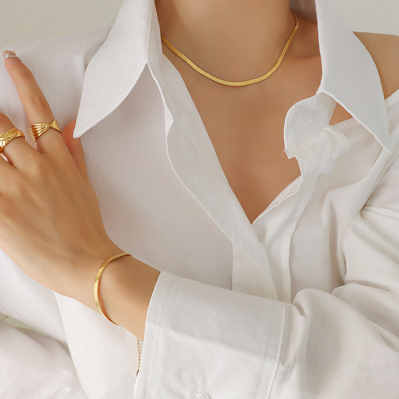 Close-up view of the intricate blade chain texture of the titanium steel jewelry.