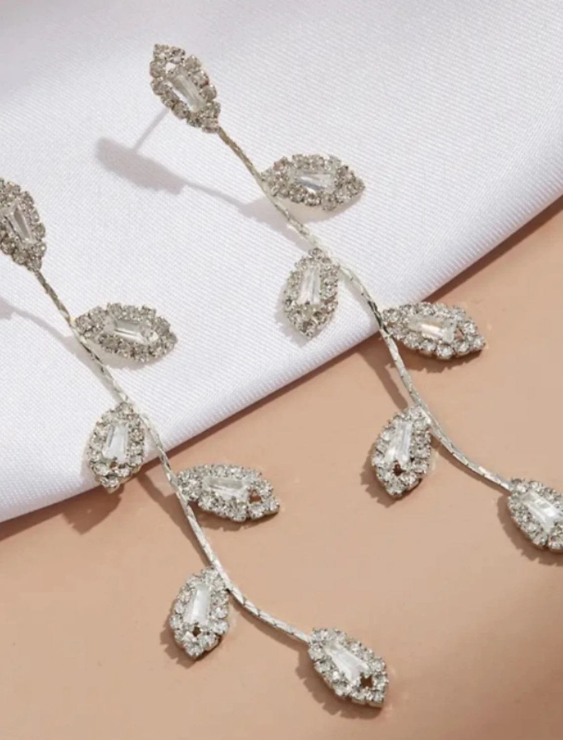 Side view of the S925 sterling silver geometrical leaf drop earring.