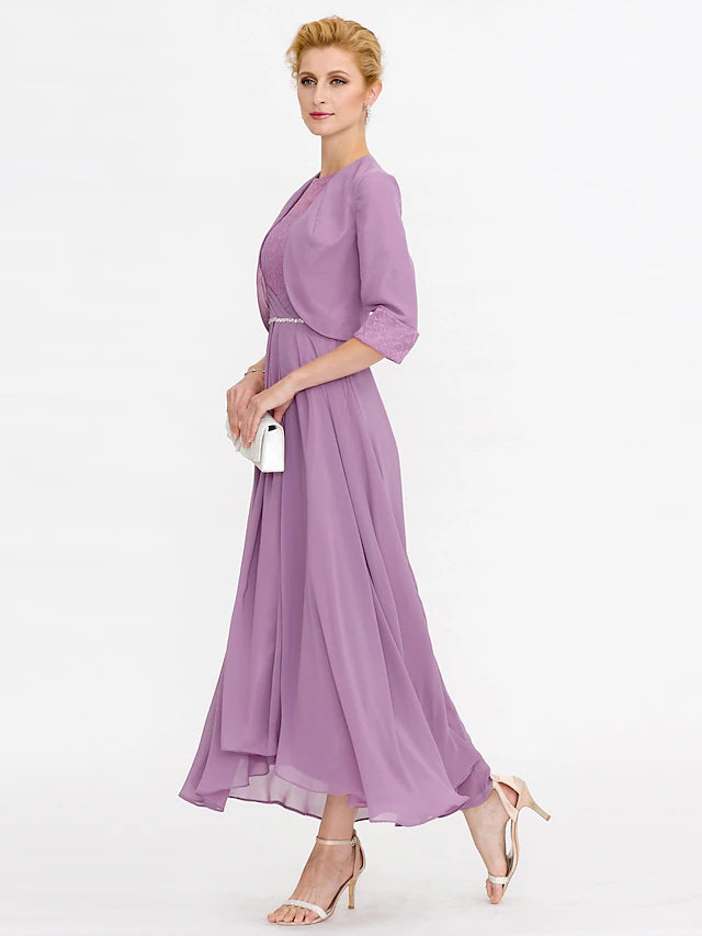 Elegant two-piece dress with a flowing skirt.