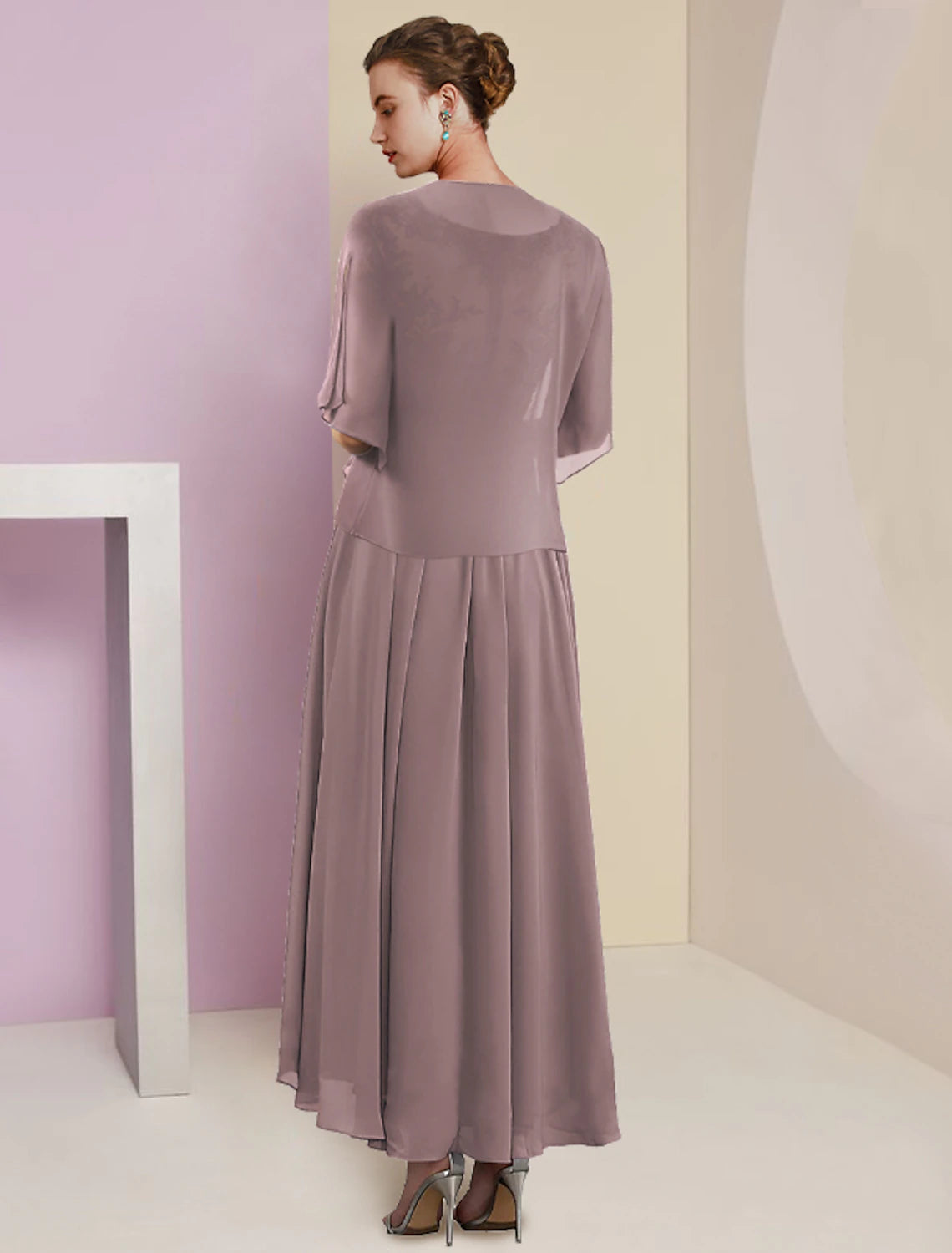 Front view of a woman in a tea length A-line dress, suitable for wedding guests.