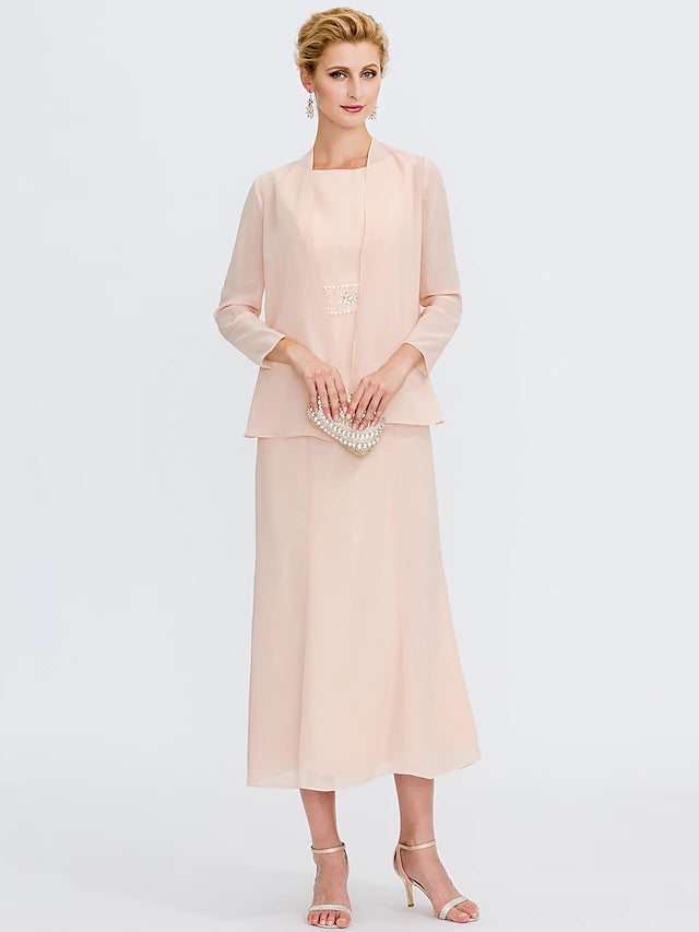 Two piece sheath dress with jewel neck and tea length.