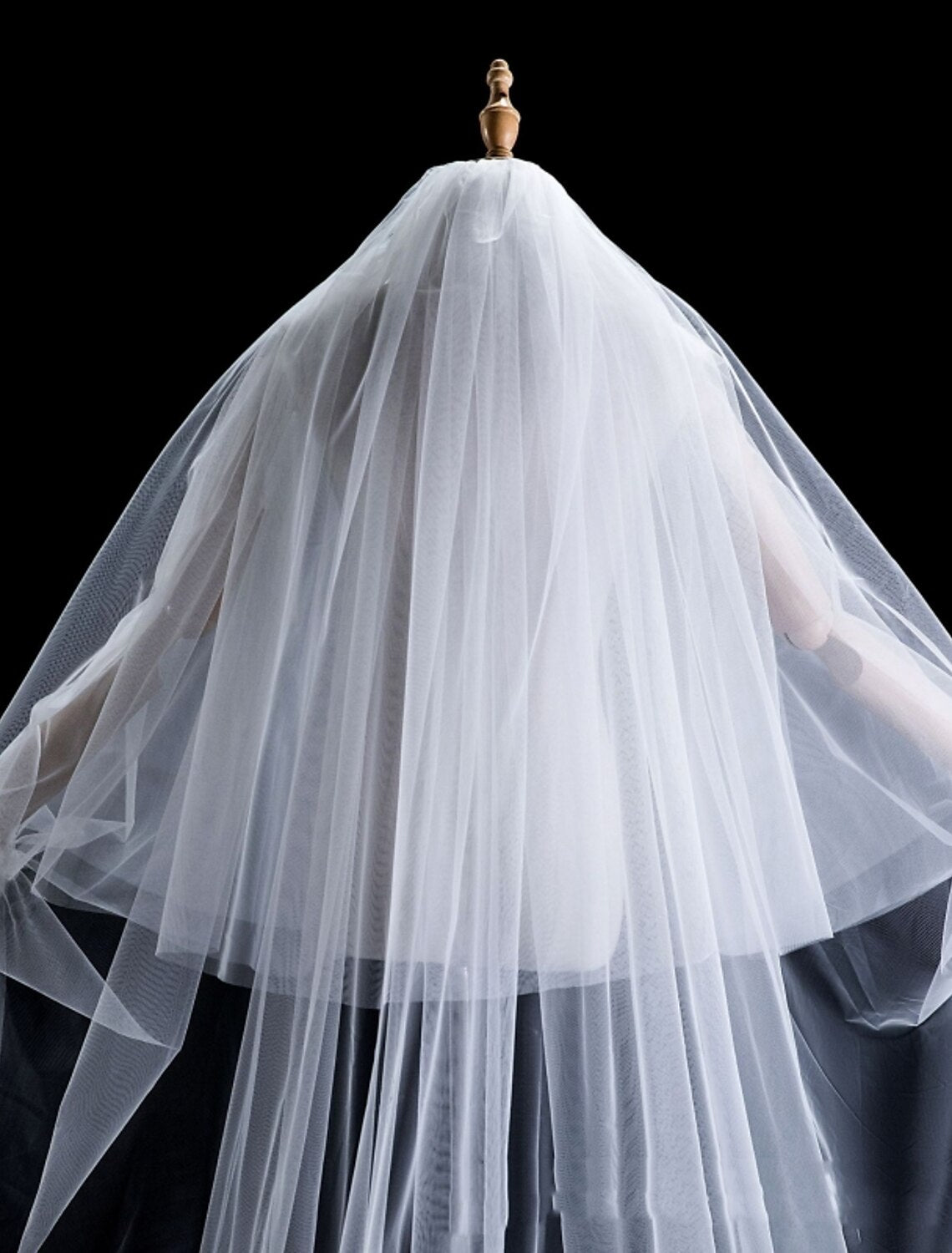Close-up of faux pearls on a wedding veil.