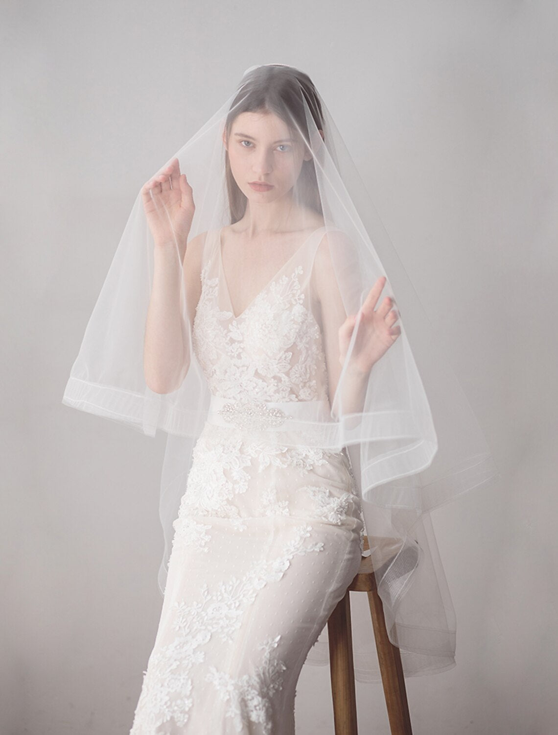 Close-up of the delicate fringe detail on a two-tier wedding veil.