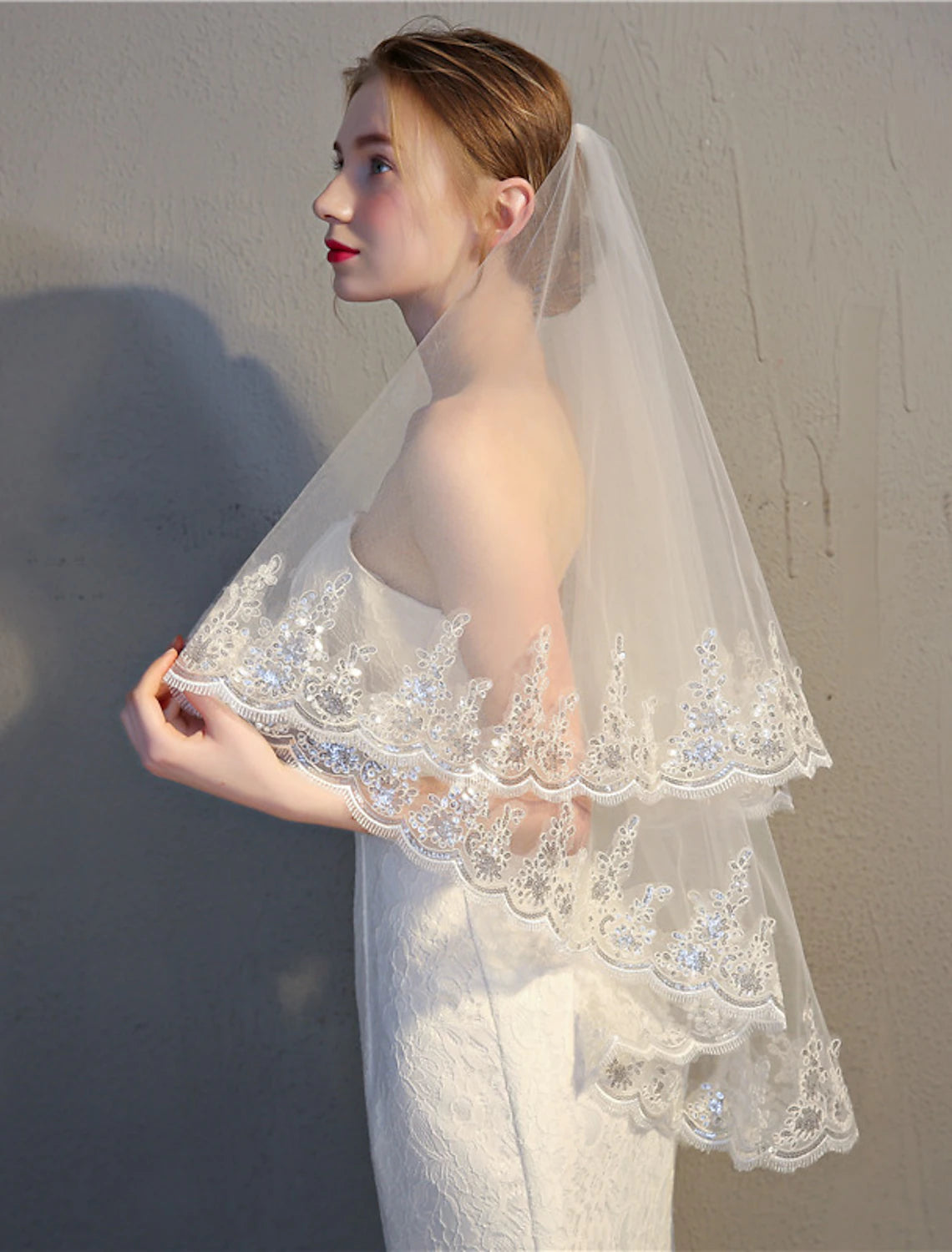 Bridal model wearing the elegant 85cm two-tier tulle wedding veil.