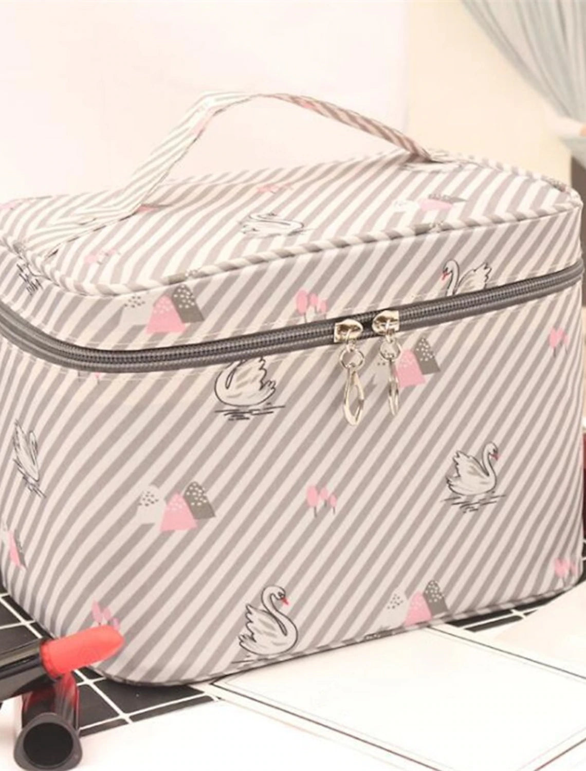 Side view of blue star polyester cosmetic bag.