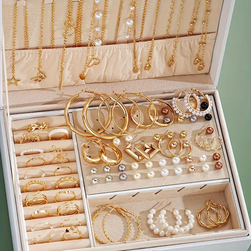 Assorted necklaces, earrings, and rings from the 56-piece jewelry set.