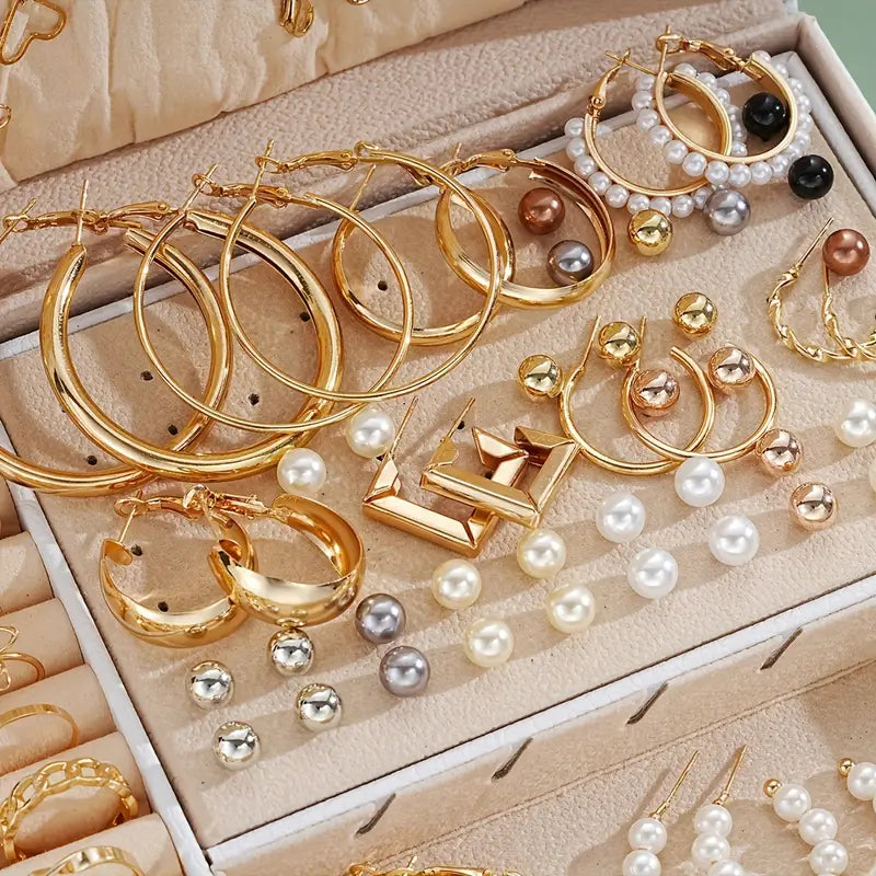 Variety of jewelry pieces including necklaces, earrings, and rings.