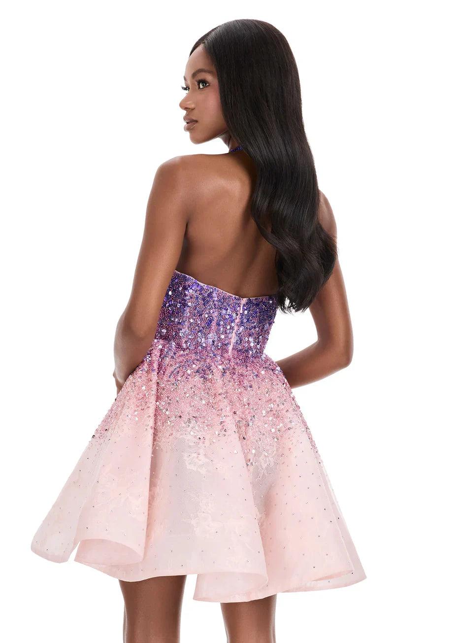 Model wearing a stunning purple-to-pink gradient sequin halter sweetheart A-line mini homecoming dress.