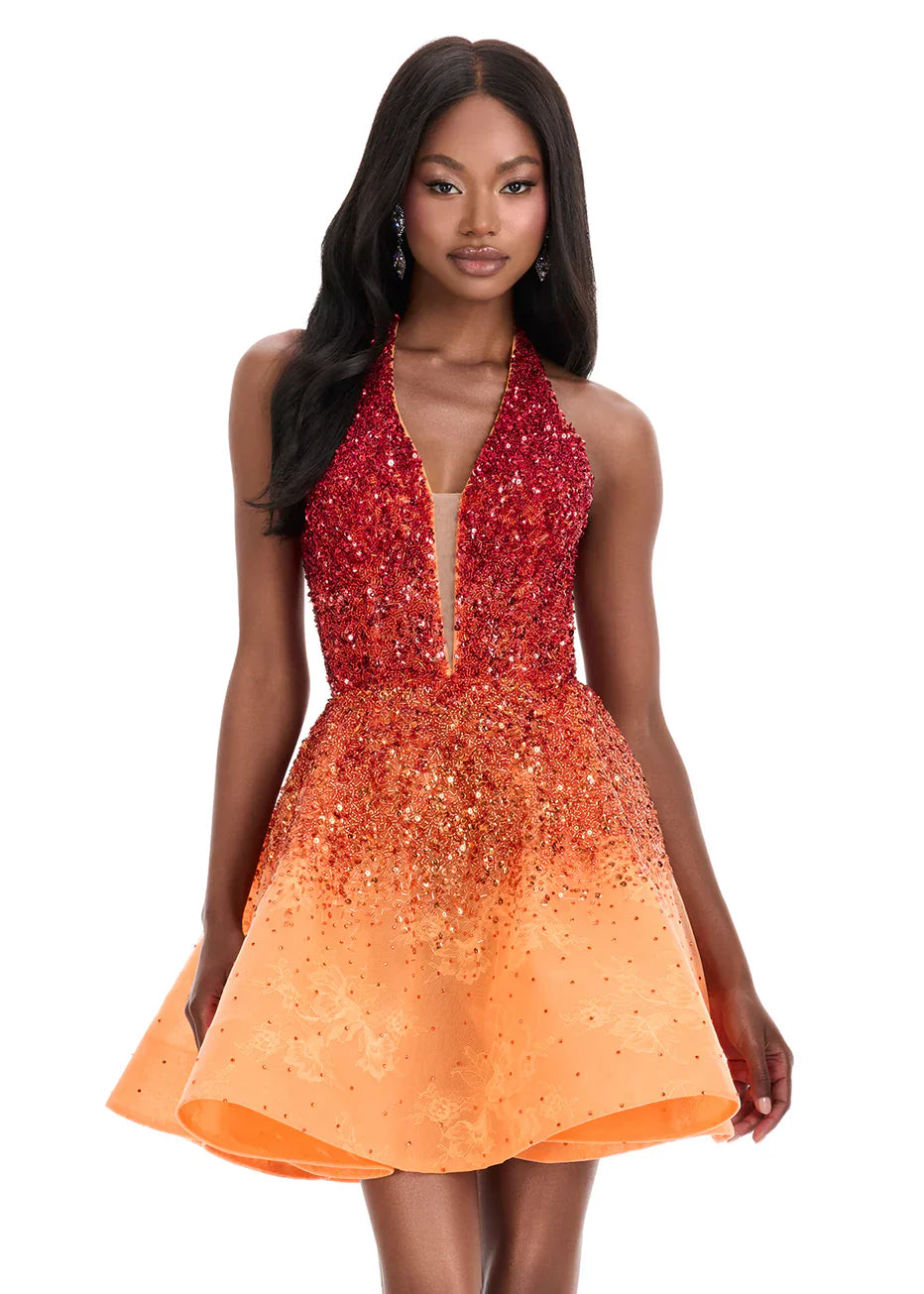 Model wearing a beautiful blue gradient sequin halter sweetheart A-line mini homecoming dress.
