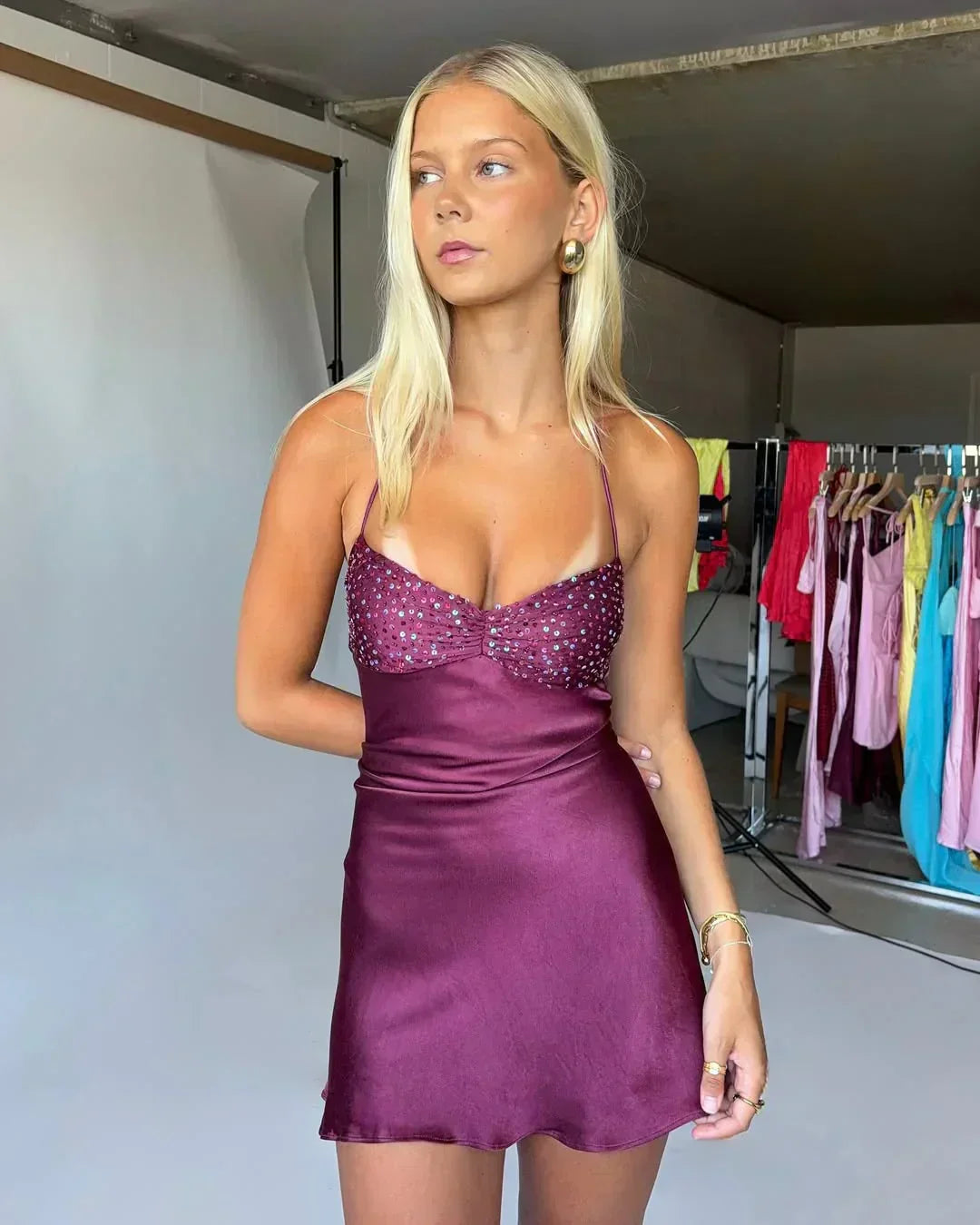Model showcasing the vibrant color of the mini homecoming dress.