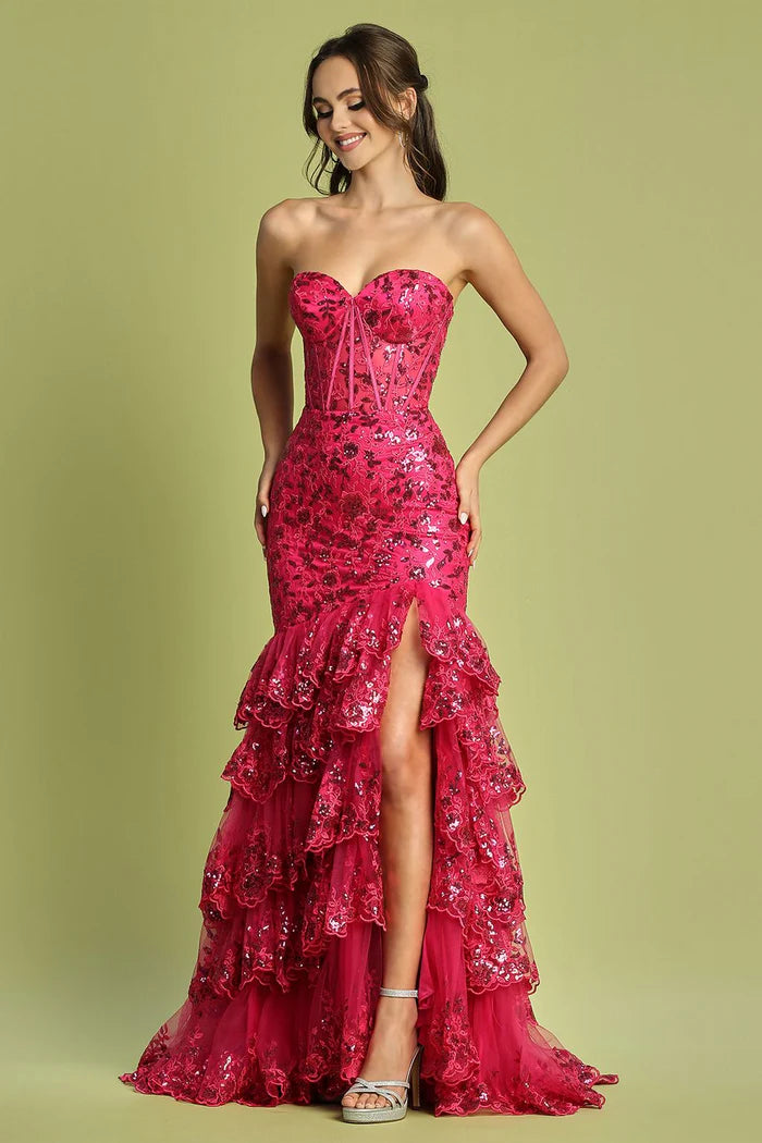 Fuchsia strapless sequin mermaid gown with ruffles and high slit.