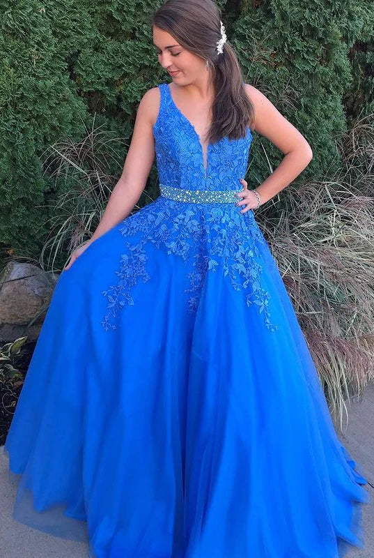 Vibrant royal blue V-neck tulle ball gown with lace and crystal embellishments.