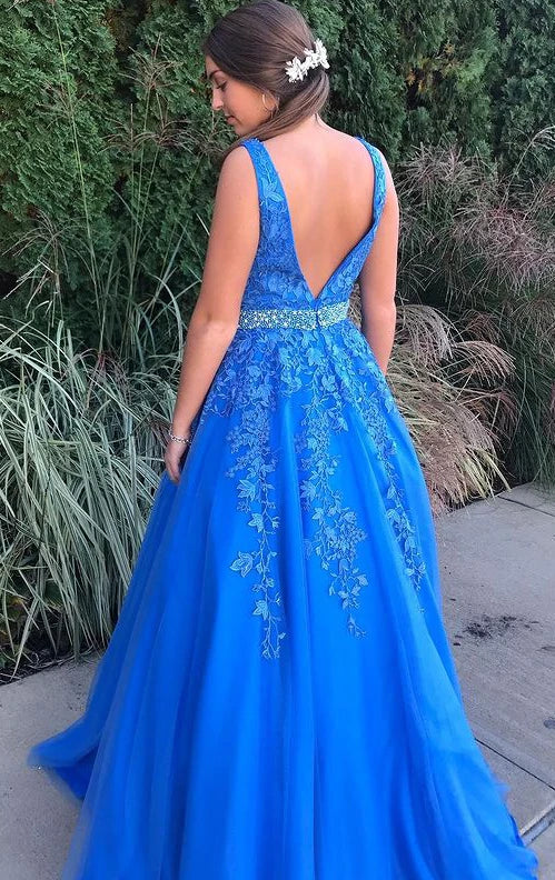 Elegant royal blue tulle ball gown with sparkling crystal waist and lace details.