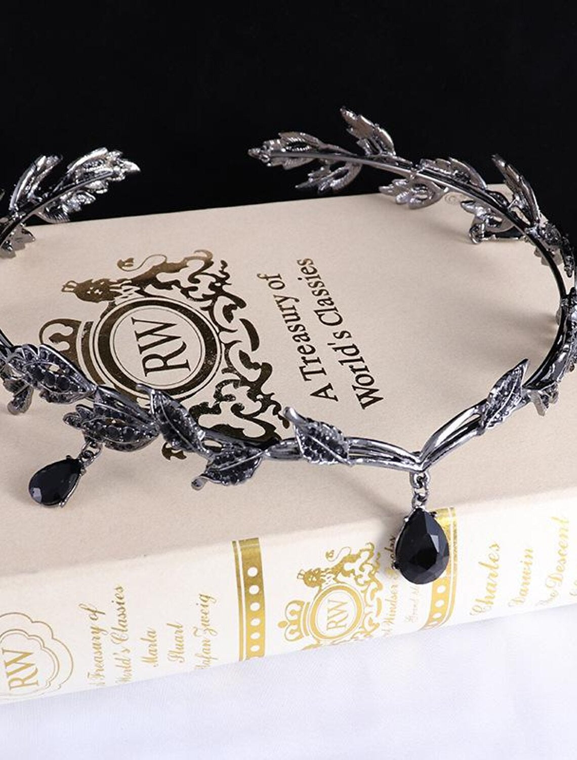Close-up of the intricate rhinestone leaf design on the bridal tiara.