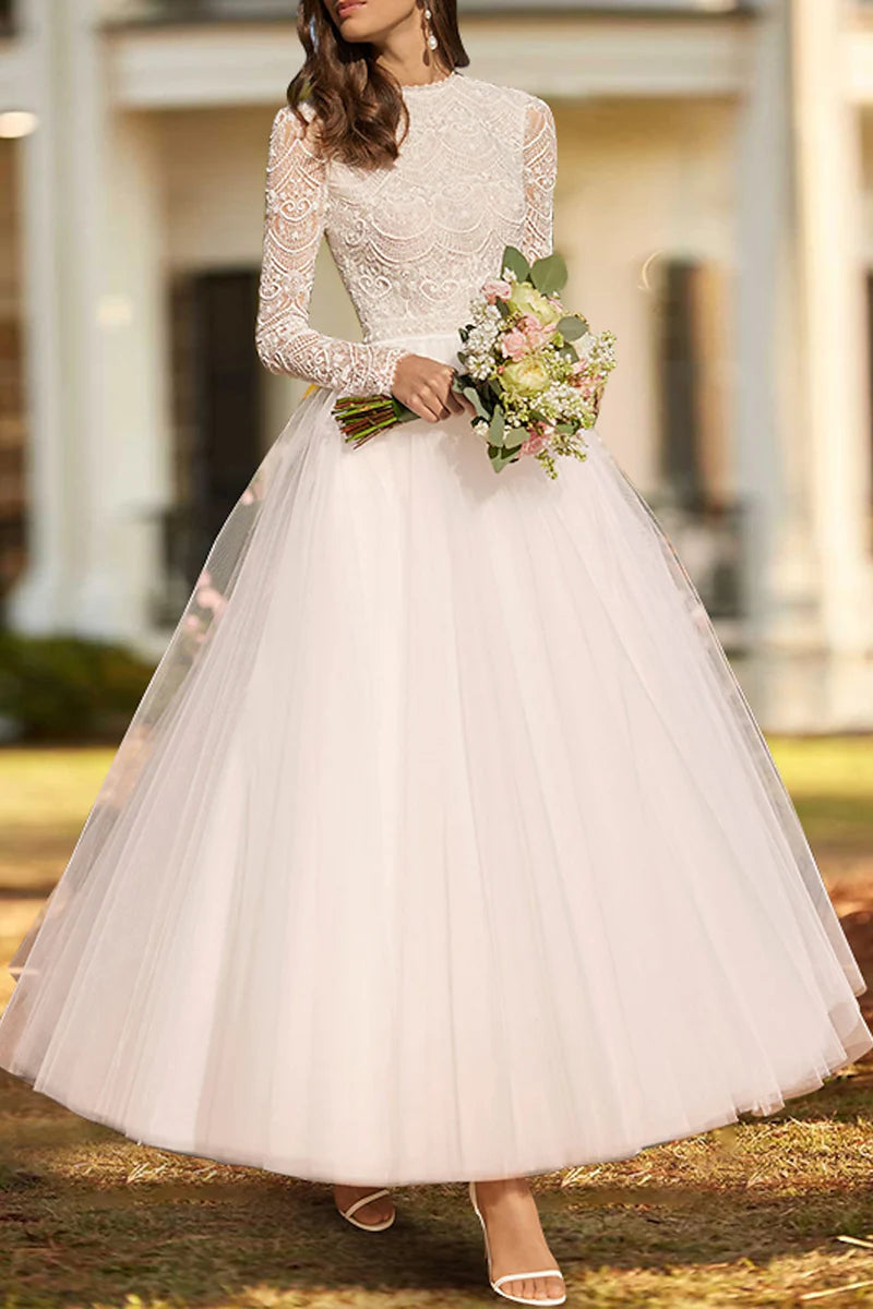 Vintage 1940s 1950s knee-length wedding dress.