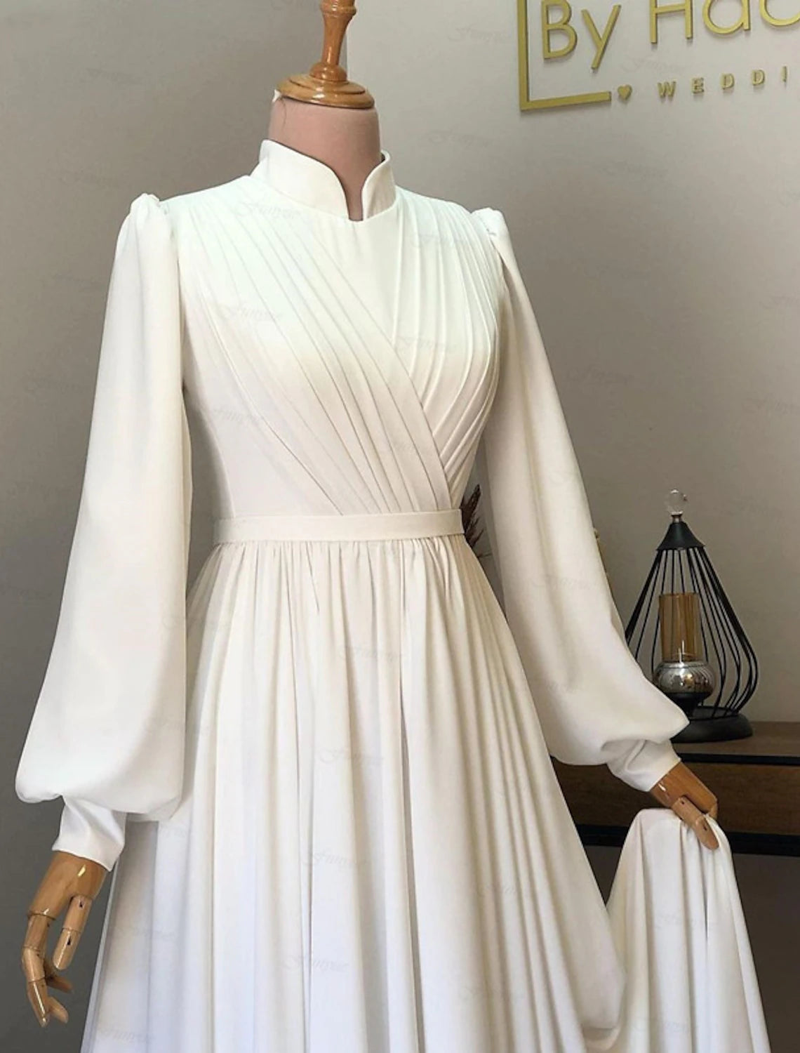 Side view of vintage chiffon wedding dress with pleats.