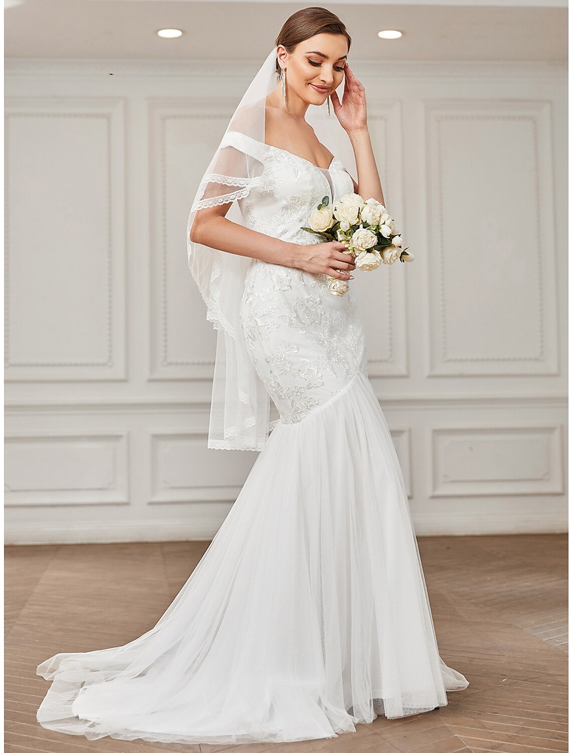 Back view of the A-line wedding dress showing the sweep train.