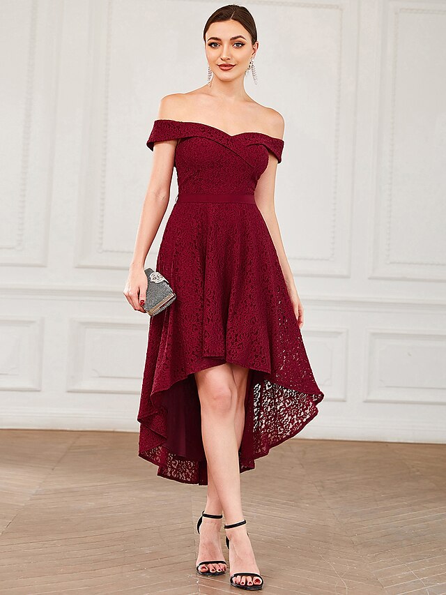 Model wearing a vintage A-line off-shoulder lace pleated asymmetrical homecoming dress.