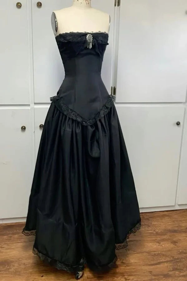 Woman wearing a vintage A-line off-shoulder floor-length prom dress.