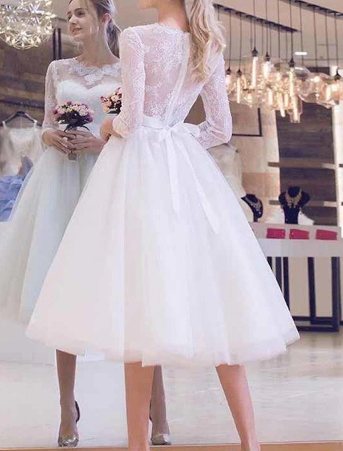 Vintage A-Line bridal gown with scoop neck and half sleeves, front view on model.