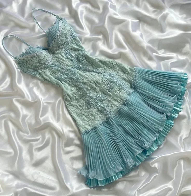 Back view of a vintage A-line homecoming dress showing corset lace-up detail.