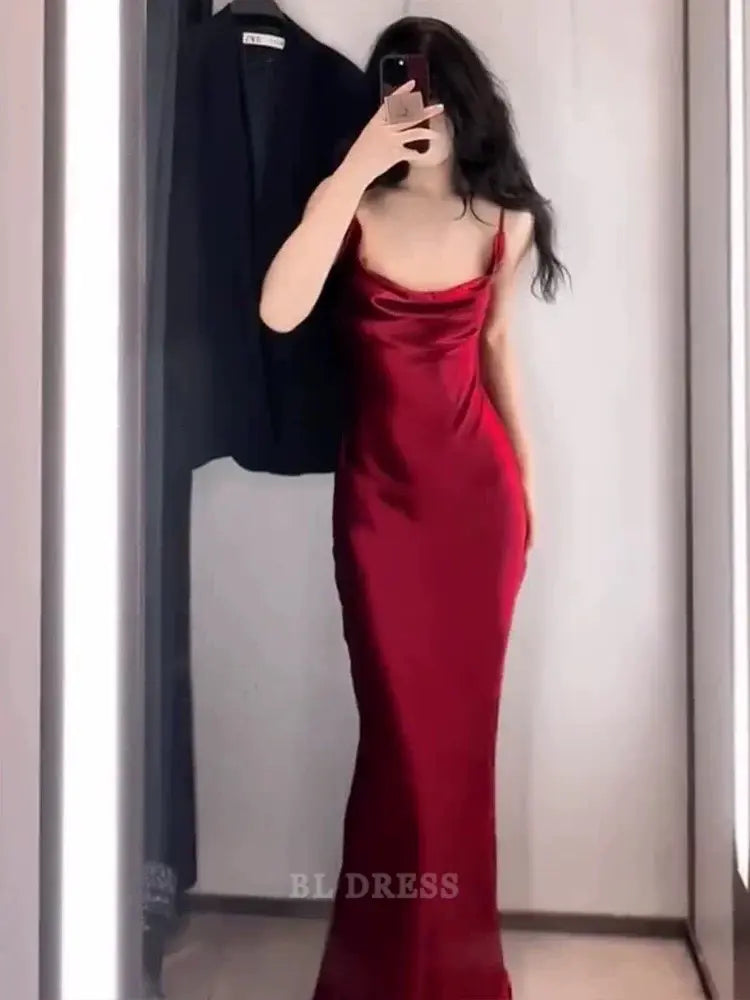 Burgundy mermaid formal dress with spaghetti straps.