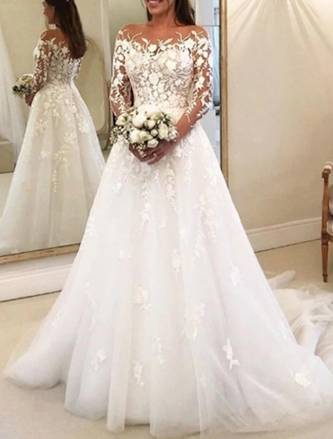 Vintage off-shoulder ball gown wedding dress with lace appliques and chapel train.